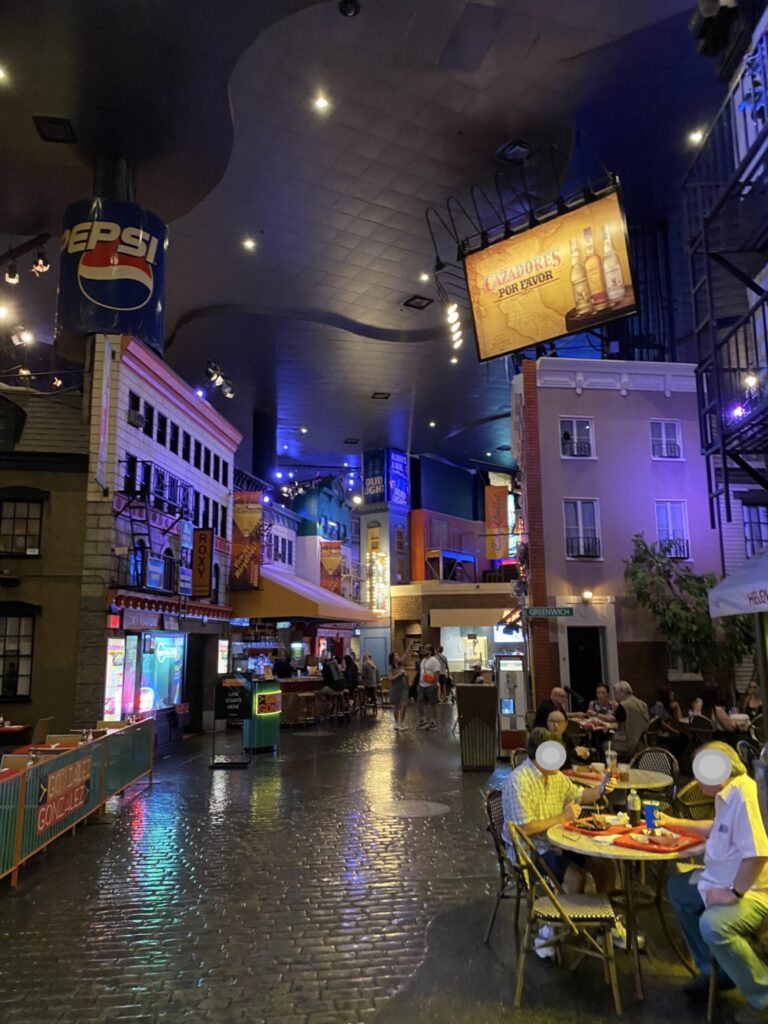 Faux cobblestone street surrounded by eateries.