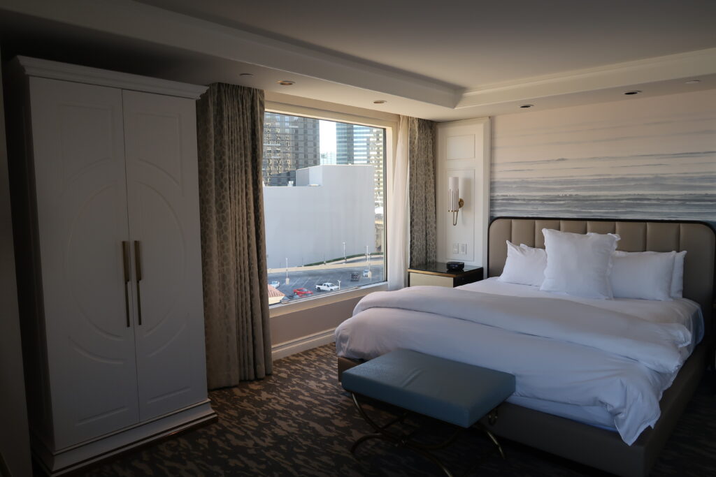 King bed with white linens in Bellagio room. 